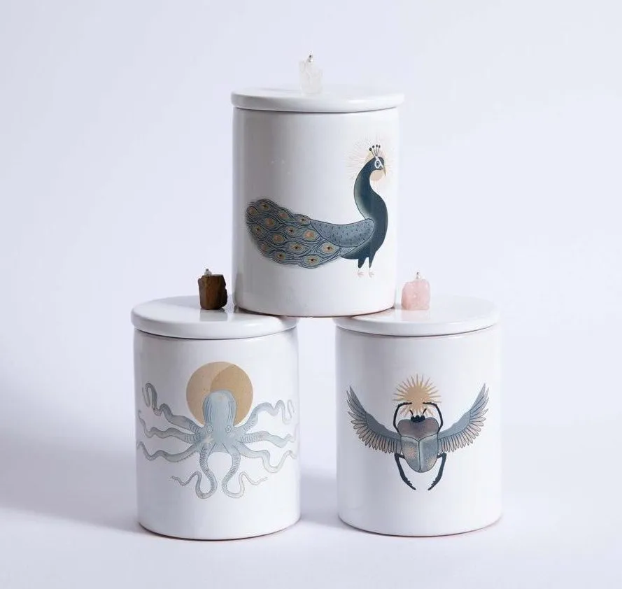NIVA Design Totem Animals Pavone candela quarzo ialino profumata