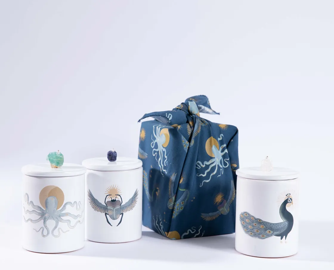 NIVA Design Totem Animals Pavone candela quarzo ialino profumata